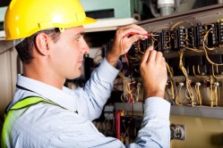 (B9)male electrician testing industrial machine.jpg